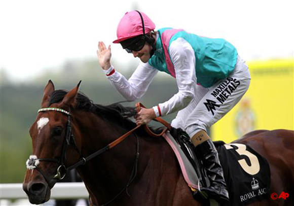 Tom Queally celebrates his victory on Frankel in the Queen Anne Stakes during day one of the 2012 Royal Ascot meeting at Ascot Racecourse, Berkshire England Tuesday June 19, 2012. (AP Photo /David Davies/PA )