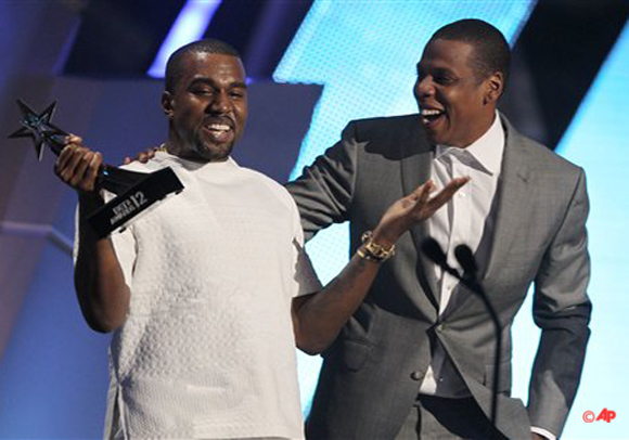 Kanye West, left, and Jay Z accept the award for best group for The Throne at the BET Awards on Sunday, July 1, 2012, in Los Angeles. (Photo by Matt Sayles/Invision/AP)