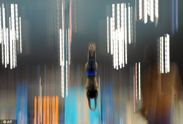 A competitor dives during a practice session at the Aquatics Centre in the Olympic Park ahead of the 2012 Summer Olympics in London, Friday, July 27, 2012. (AP Photo)