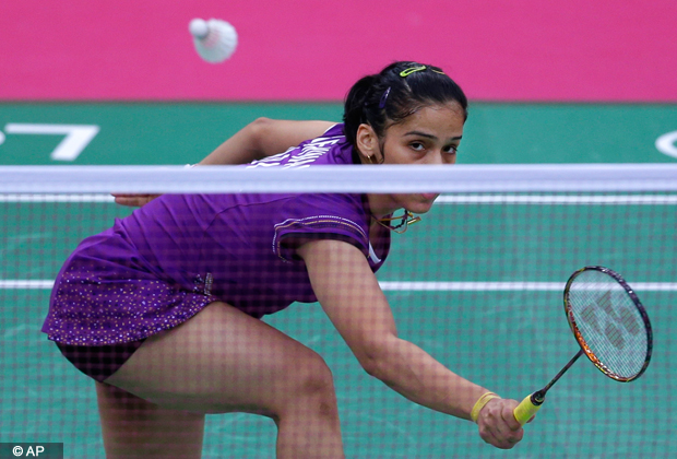 India's Saina Nehwal plays against Switzerland's Sabrina Jaquet, unseen, at a women's singles badminton match of the 2012 Summer Olympics, Sunday, July 29, 2012, in London. (AP Photo)