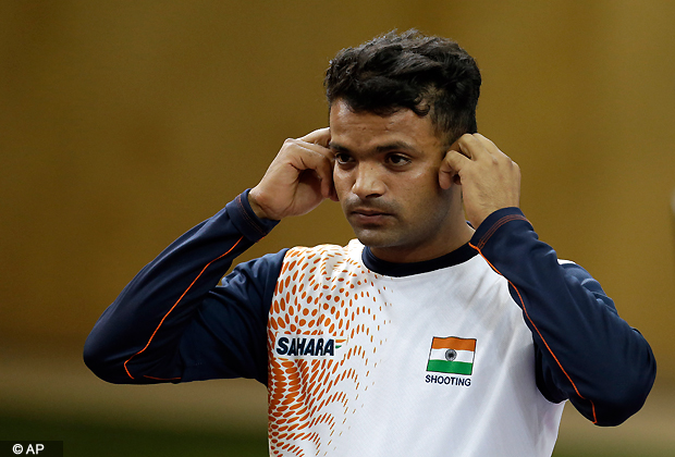 India's Vijay Kumar removes his ear plugs at the end of the men's 25 meter rapid fire pistol final at the 2012 Summer Olympics, Friday, Aug. 3, 2012, in London. Kumar finished second to win the silver.(AP Photo)