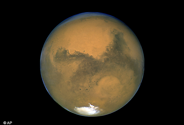 This Aug. 26, 2003 image made available by NASA shows Mars photographed by the Hubble Space Telescope on the planet's closest approach to Earth in 60,000 years. NASA's robotic rover Curiosity landed safely on Mars late Sunday, Aug. 5, 2012 to begin two years of exploration. (AP Photo)