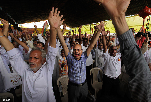 Supporters of Baba Ramdev shout slogans during a mass anti corruption protest, in New Delhi, Thursday, Aug. 9, 2012. Thousand of supporters from across the country poured into the capital to pledge their support to Ramdev's anti corruption crusade. (AP Photo)