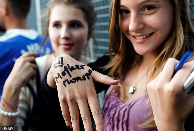 Lithuanian fans wait for the arrival of Lady Gaga at Vilnius airport in Vilnius, Lithuania, Monday, Aug. 20, 2012. Lady Gaga will hold a concert in Vilnius as part of her Europe tour. (AP Photo)