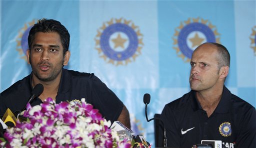 India cricket captain Mahendra Singh Dhoni, left, speaks as coach Gary Kirsten looks on during a press conference in Mumbai, India, Tuesday, April 27, 2010. The Indian team leaves Tuesday night for the Twenty20 Cricket World Cup, scheduled to begin on April 30 in the West Indies. (AP Photo/Rafiq Maqbool)