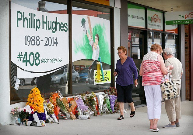 People paying tribute to Phil Hughes.