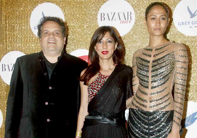 Designer Sandeep Khosla and Malini Ramini clicked with a model at the event.