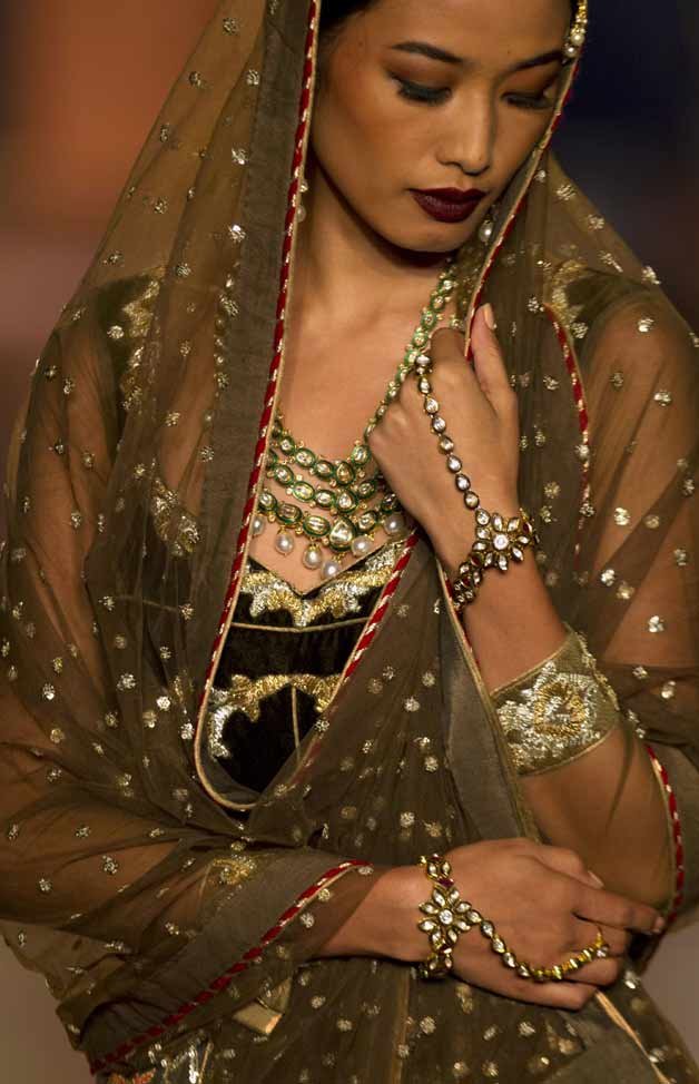 A model displays a creation by Indian designer Reynu Taandon at the Amazon India Couture Week 2015 in New Delhi.