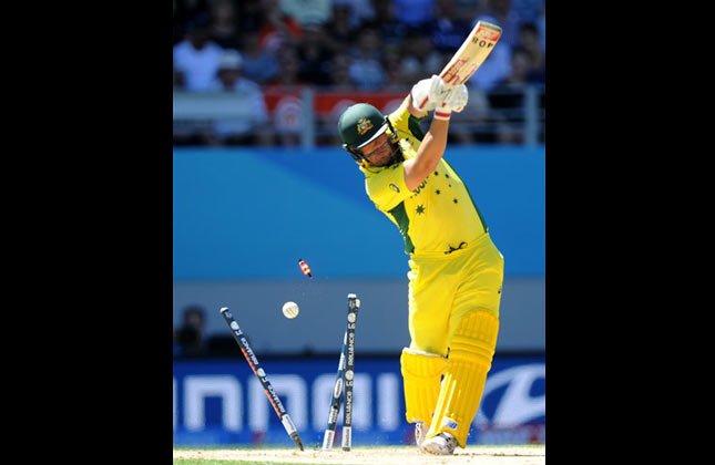 Australian batsman Aaron Finch is bowled during their Cricket World Cup match against New Zealand in Auckland, New Zealand, Saturday, Feb. 28, 2015. (AP Photo)