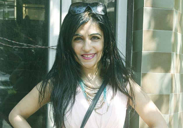 Singer Shibani Kashyap dressed in a baby pink short frock, attended Holi party at filmmaker Sanjay Gupta's house.