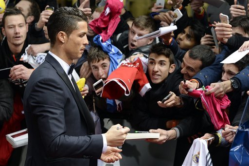 Cristiano Ronaldo giving autograph to fans