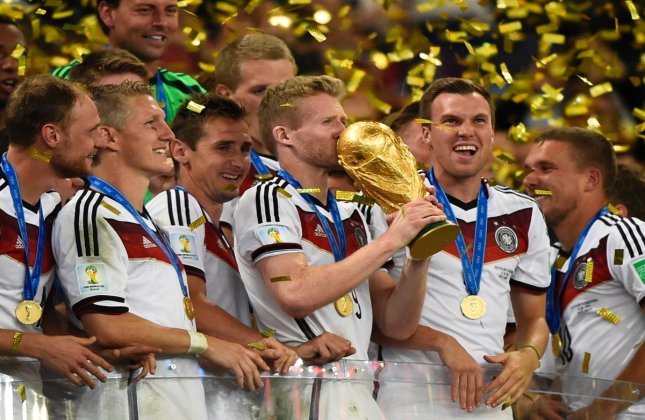 Germany team celebrating with FIFA World Cup trophy 2014.