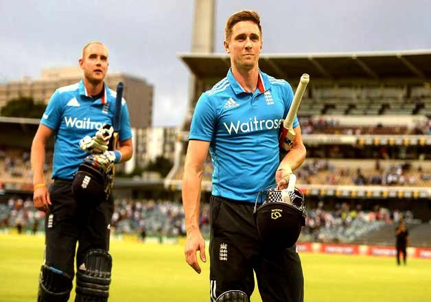 England's Stuart Broad and Chris Woakes walks off the ground after England defeated India by 3 wickets in one day international cricket match in Perth, Australia, Friday, Jan. 30, 2015.