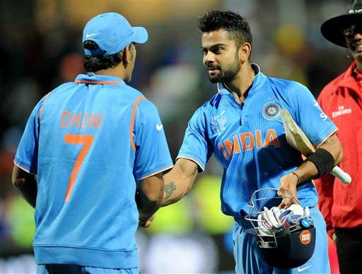 India's Virat Kohli, right, is congratulated by his captain MS Dhoni after they defeated Ireland by eight wickets in their Cricket World Cup Pool B match in Hamilton, New Zealand, Tuesday, March 10, 2015. (AP Photo)