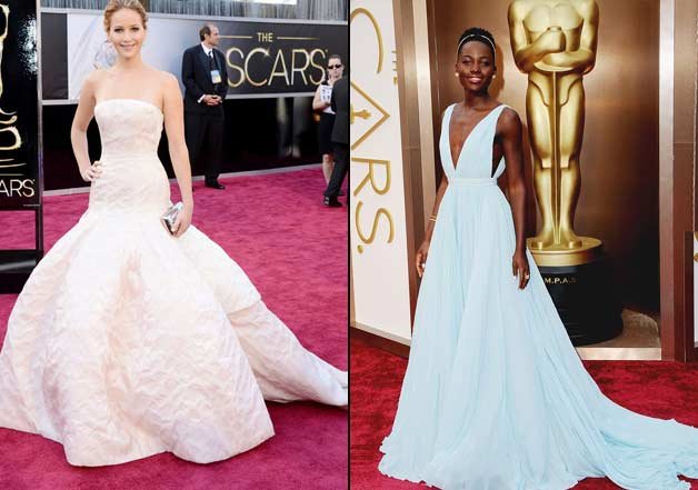 Jennifer Lawrence (left) arrives in for the 2013 Academy Awards donning this stunning Christian Dior couture gown paired with Chopard jewelry and a Roger Vivier clutch. Actress Lupita Nyong'o nailed it with custom made sky blue silk georgette gown by Prada at the 2014 Oscars.