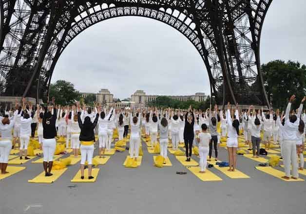 Thousands of participants dressed in white performed Yoga beneath the Iconic Eiffel Tower in France to be a part of first International Yoga Day celebration.