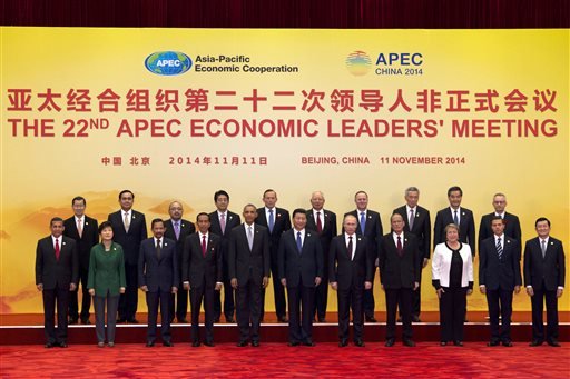 Leaders pose for a group photo at the Asia Pacific Economic Cooperation (APEC) summit at the International Convention Center in Yanqi Lake, Beijing