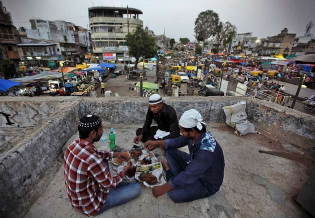 Indian Muslims breaks their fast in Ahmedabad, India.
