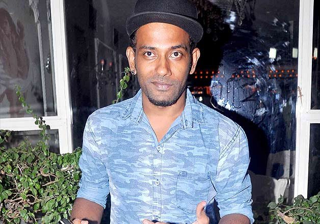 Popular dancer and choreographer Dharmesh posed for the shutterbugs as he arrived to attend the screening. The man rose to fame from her skills in DID.