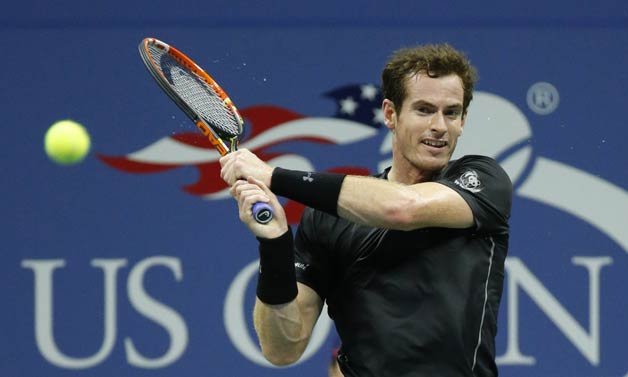 Andy Murray, of Britain, returns a shot to Thomaz Bellucci, of Brazil, during the third round of the U.S. Open tennis tournament in New York.