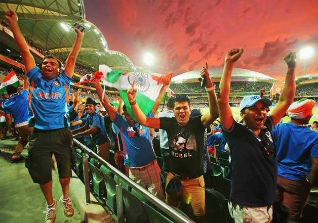 The overwhelmed crowd celebrates as India takes the final Pakistani wicket and wins the match by 76 runs.